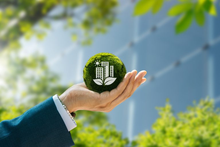 Hand holding icon of Office Sustainability